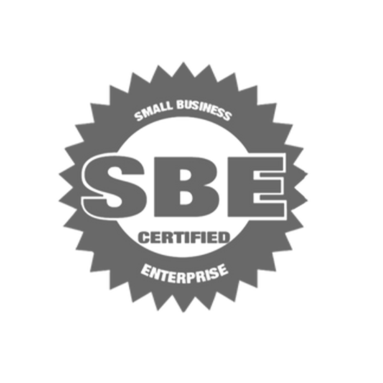 The SBE Small Business Enterprise logo features the letters 'SBE' in dark gray with the words 'Small Business Enterprise'. The logo represents a certification program for small businesses that meet certain eligibility criteria, providing opportunities for them to participate in government contracts and procurement processes. The SBE program is designed to promote small business development and economic growth.